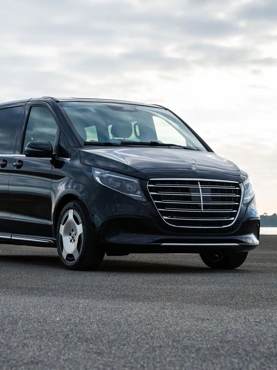 Black Mercedes V-Class outside an office building